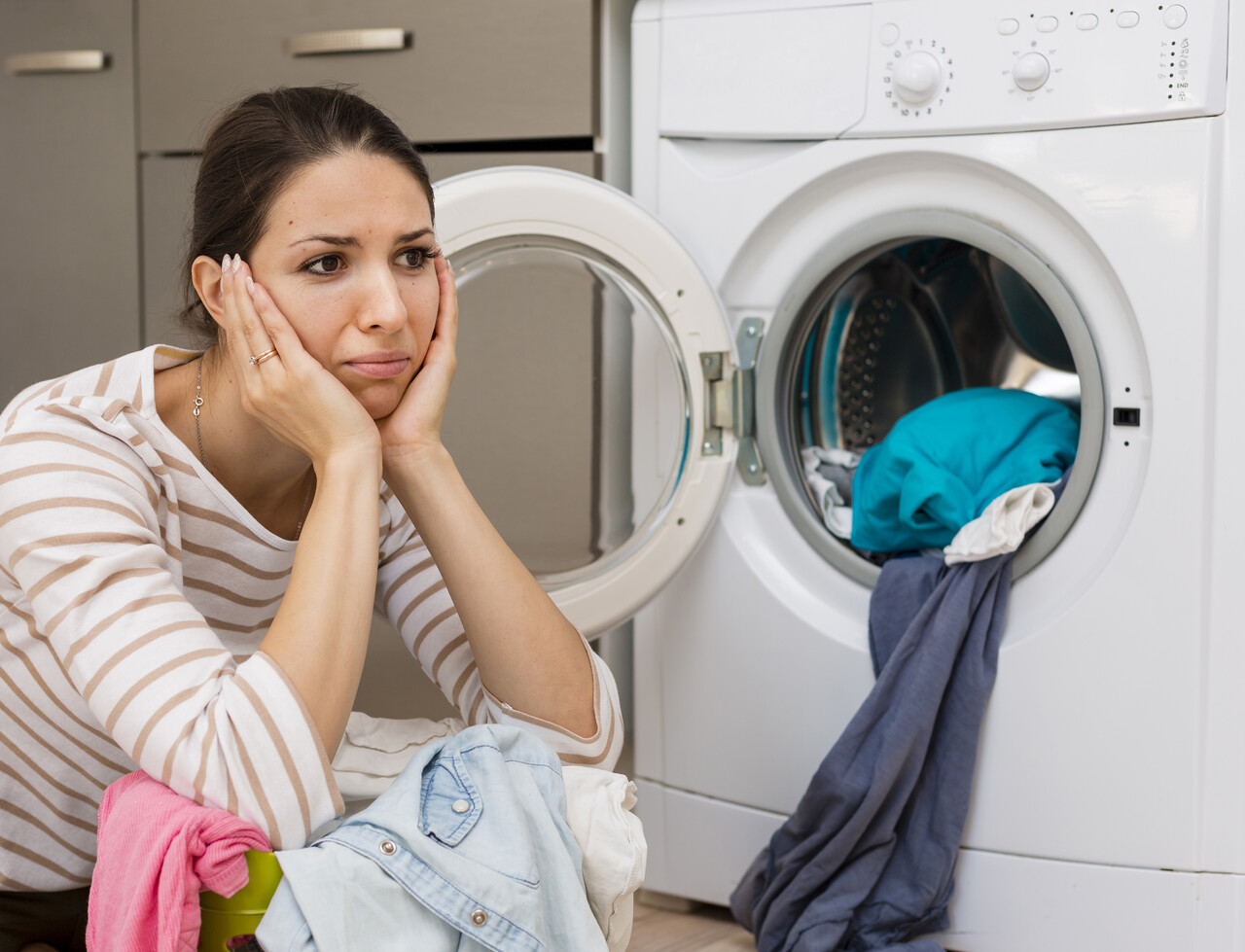 stressed-woman-doing-laundry-medium-shot_Easy-Resize.com